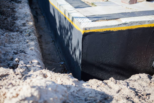 Professional Basement Waterproofing technician working in Scandinavia, WI